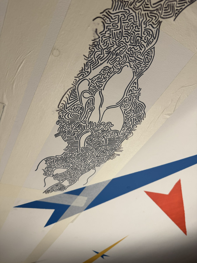 Process view of ceiling decoration with black linework and coloured geometric forms